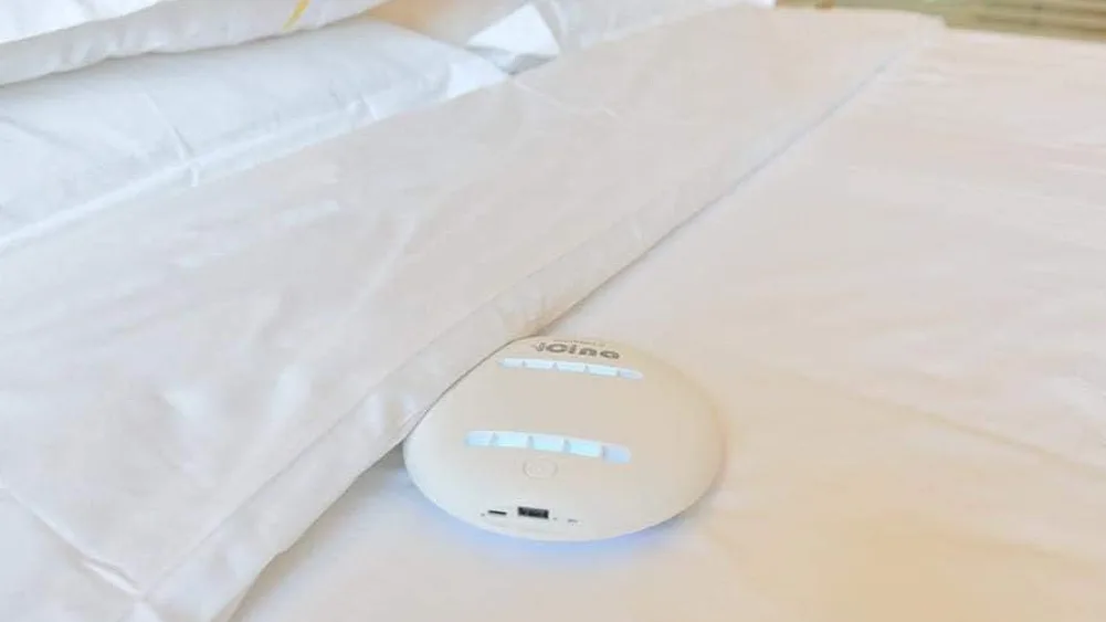 NerriClean device next to phone